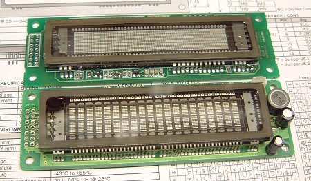 Picture showing the new graphic VFD module next to the
      text-only device (49KB)